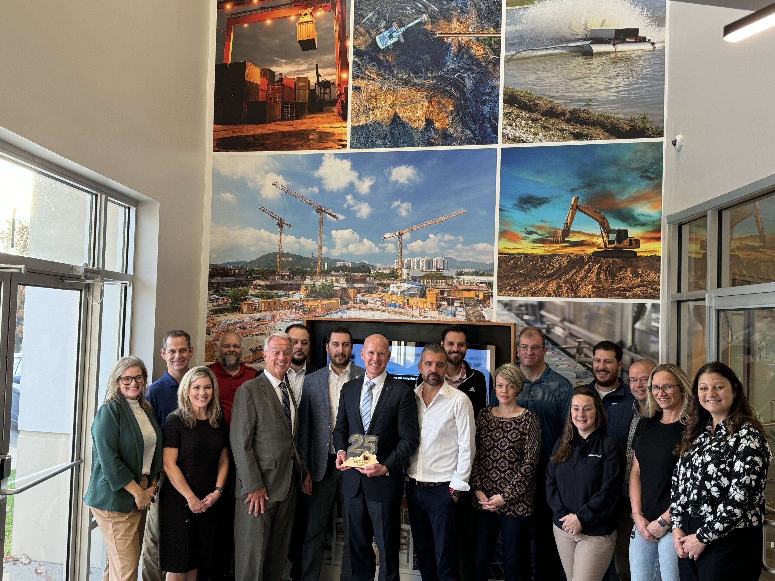 A large group of people pose for a photo at Bonfiglioli USA, celebrating the company's 25th anniversary