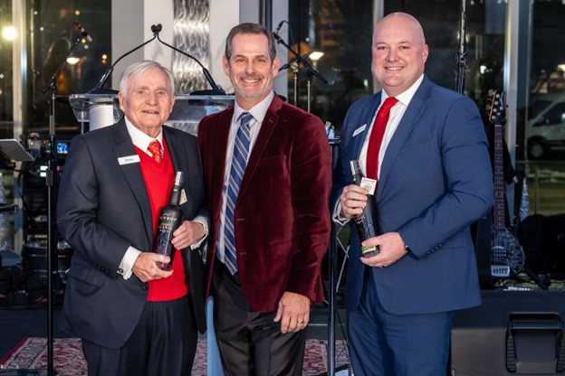 Bill Butler, Lee Crume and Brett Blackwell celebrate Corporex's anniversary