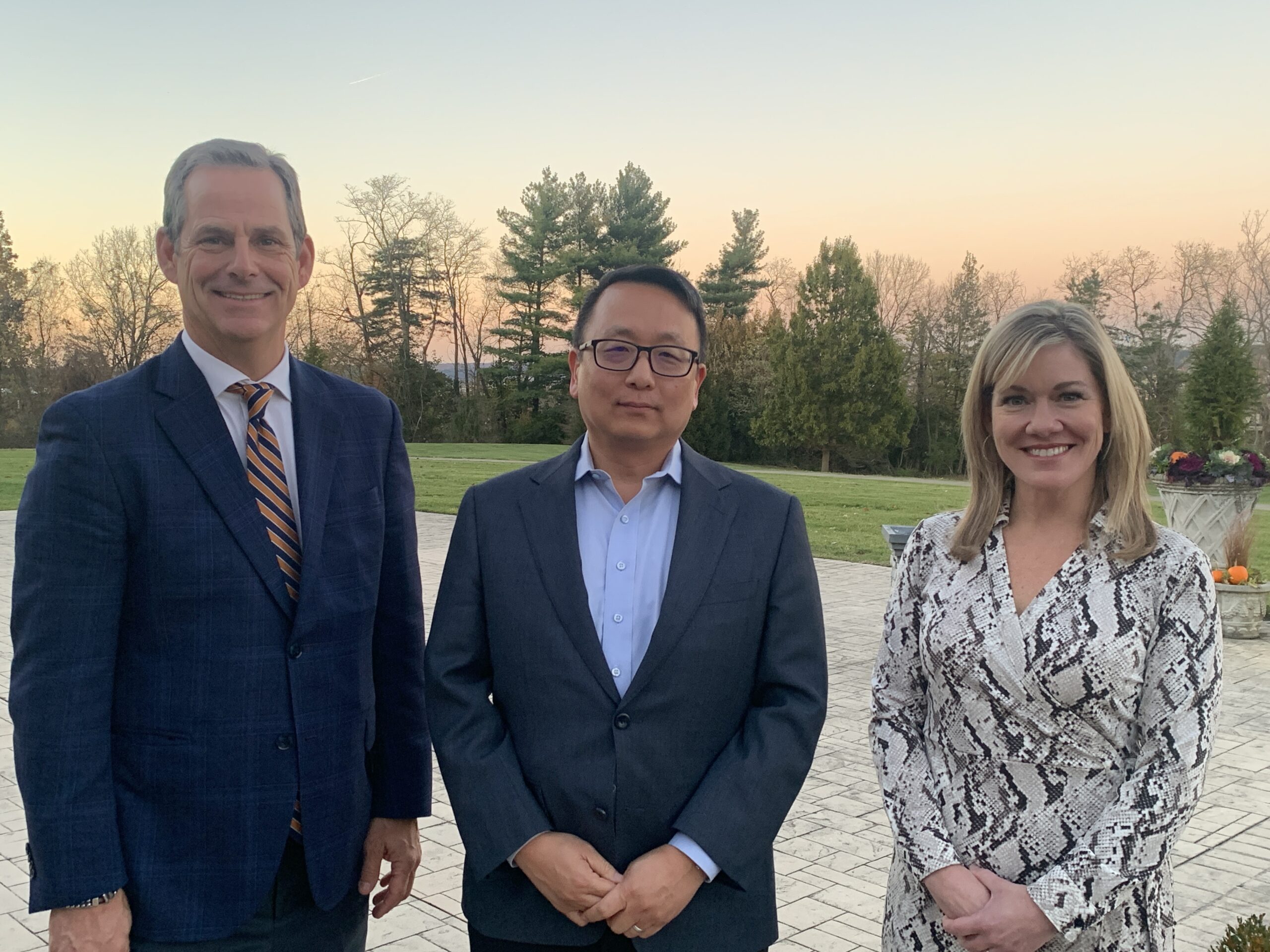 BE NKY's Lee Crume, EY's Jung Kim and BE NKY's Kimberly Rossetti stand together at Drees Pavilion after BE NKY's Q4 2025 Economic Development Briefing.