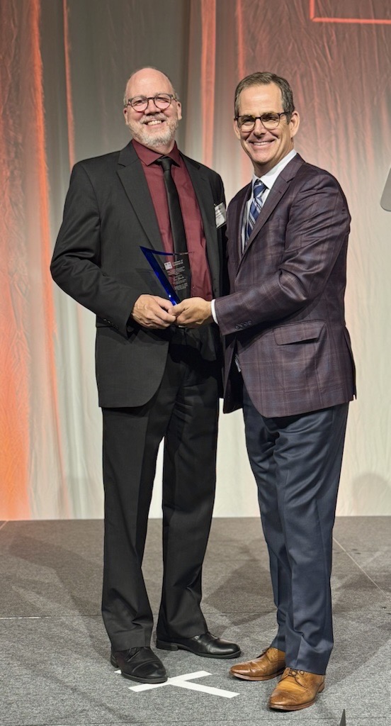 Image (1) Tom Banta holding award and standing with Lee Crume at Northern Kentucky Chamber of Commerce Annual Dinner